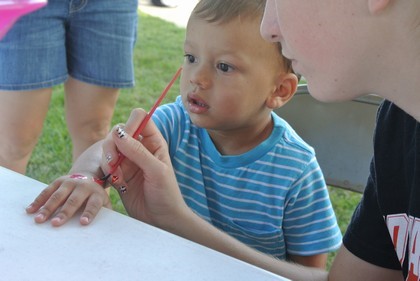 Artist Paints a Child's Hand