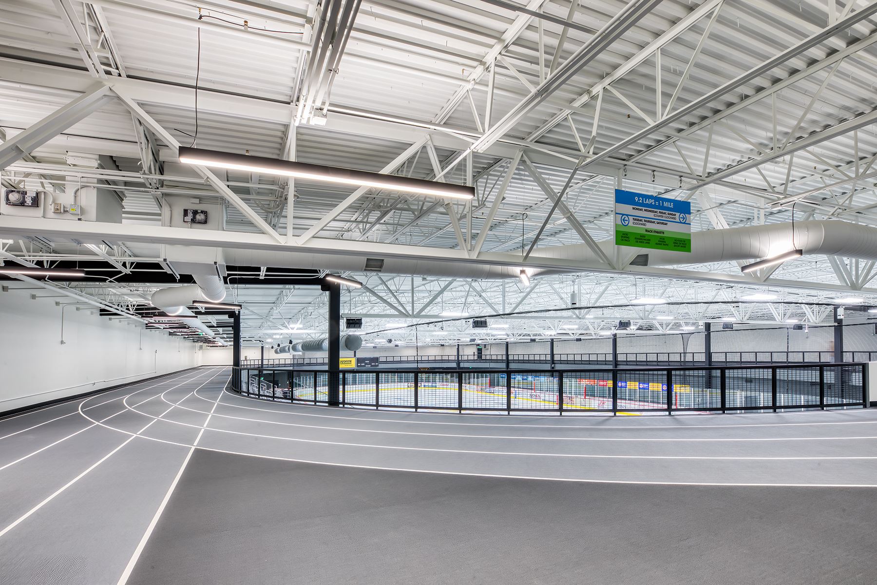 An image of an indoor track above and encircling an ice rink