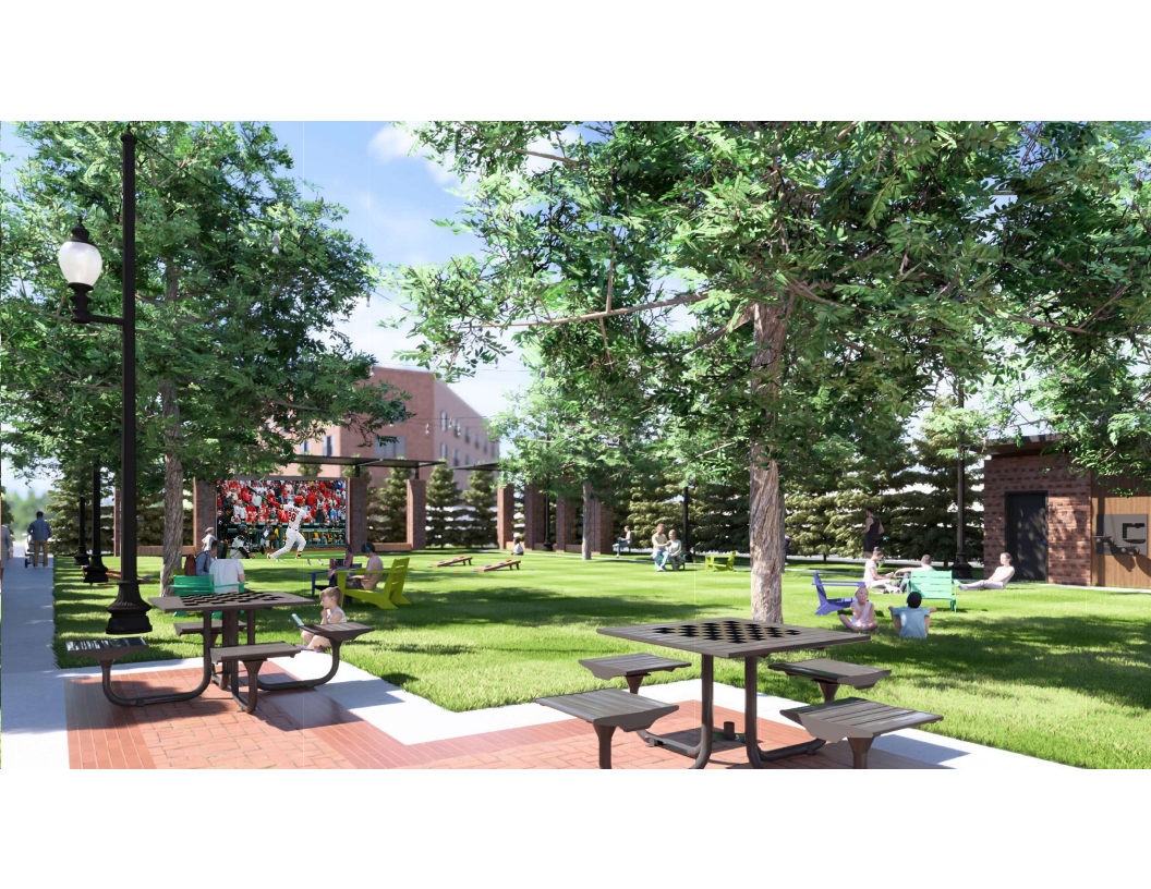 A tree-filled, grassy park area